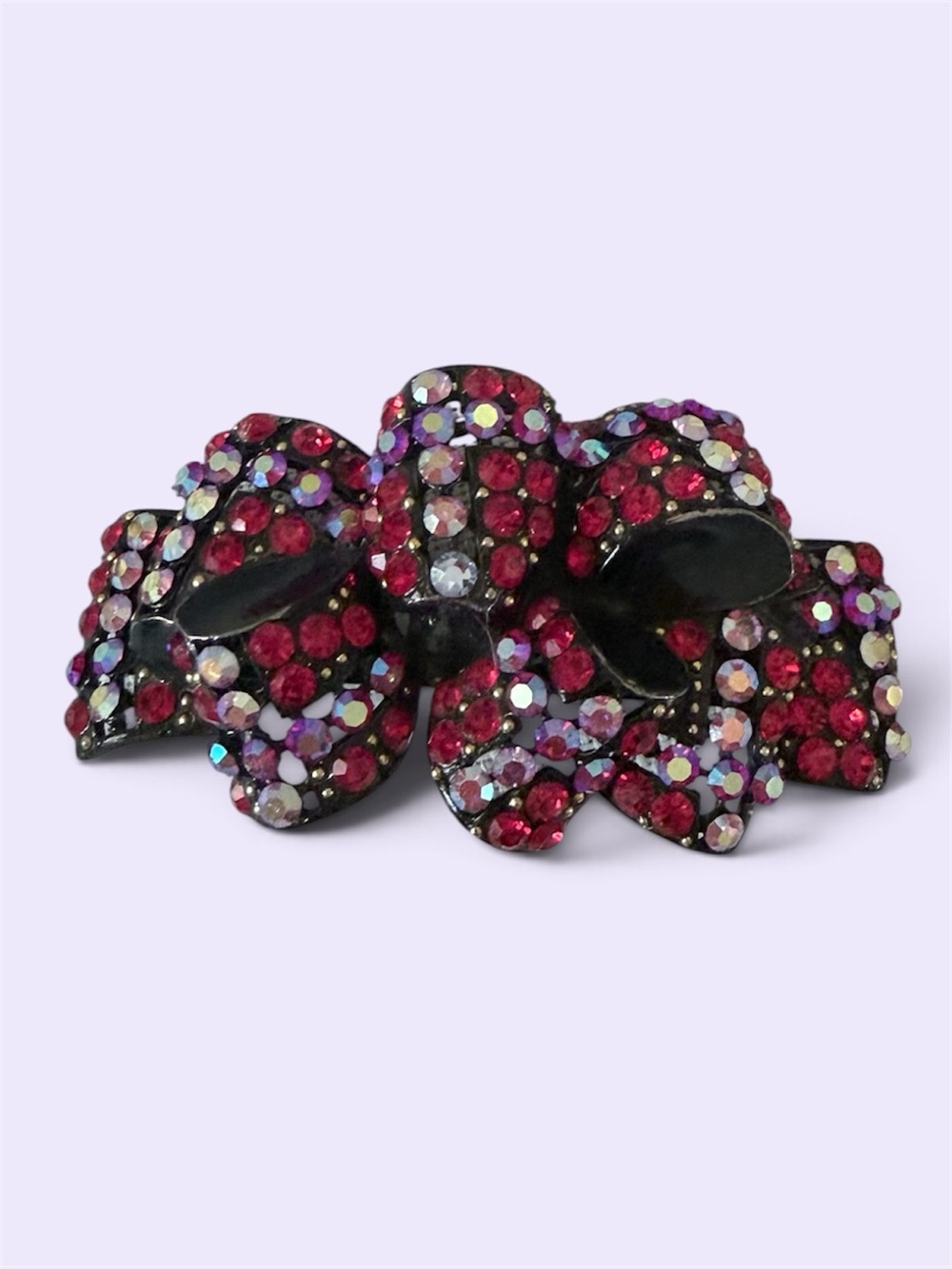 red rhinestone bow hair claw clip embellished with sparkling red and aurora bore
